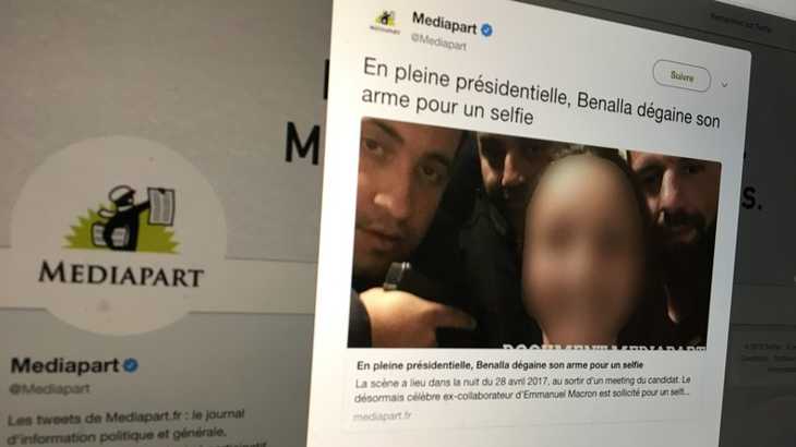 son arme pour un selfie
